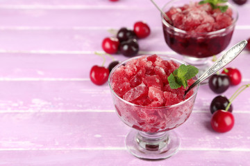 Closeup of cherry granita in glass bowls,