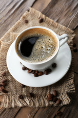 Cup of coffee on wooden table