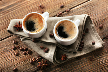 Two cups of coffee on wooden table