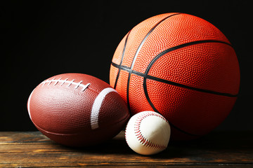 Sports balls on black background