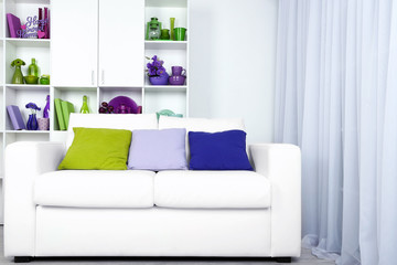Modern interior design. White living room with sofa and