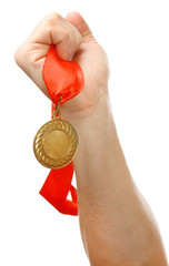 Naklejka na ściany i meble Golden medal in hand isolated on white