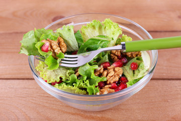 Fresh salad with greens, garnet and spices