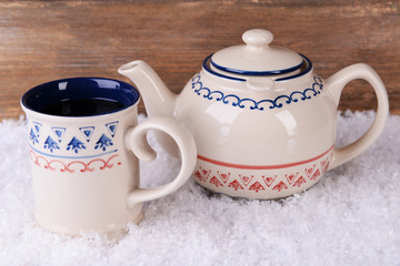 Cup of tea on table on wooden background