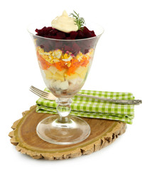 Russian herring salad in glass bowl,