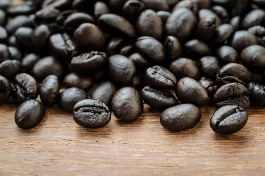 Coffee beans on wooden background