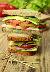 Sandwiches with fresh vegetables, cheese and ham