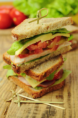 Sandwich with ham, cheese, toamtoes and fresh lettuce