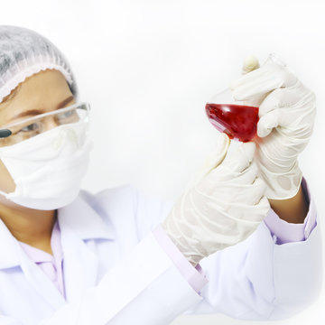 Medical technician examining blood test