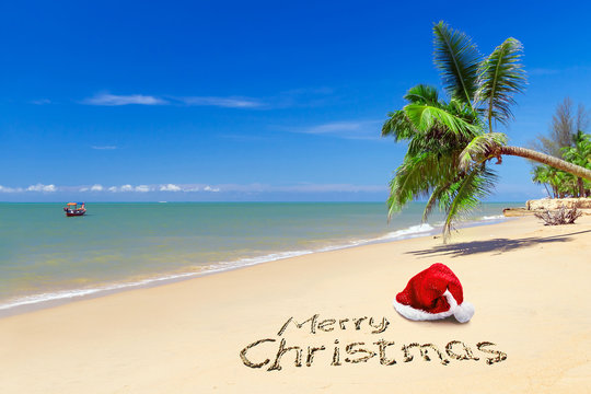 Merry Christmas with santa hat from the tropical beach