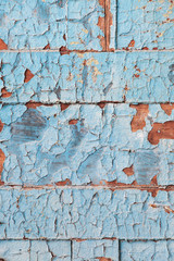 Obraz premium Peeling blue paint on wooden planks with selective focus