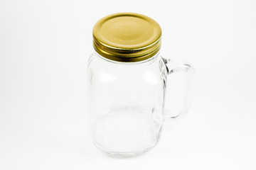 An empty clear jar with the cap