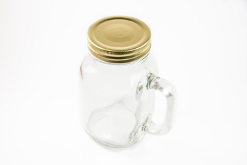 An empty clear jar with the cap