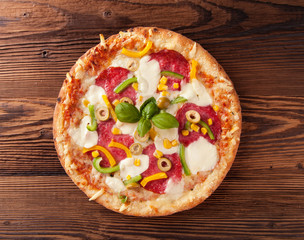 Delicious fresh pizza served on wooden table