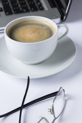 cup of coffee in a white cup on a white plate