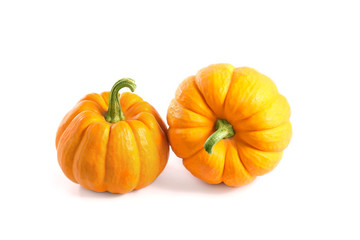 Two small decorative pumpkins