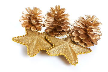 Golden pine cones and stars macro isolated