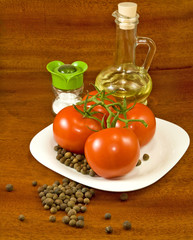 tomatoes, oil and salt on the table