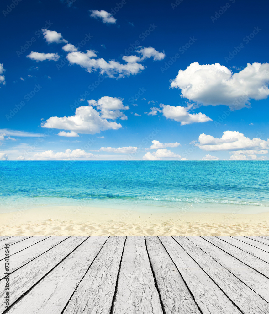 Wall mural Empty wooden pier beside tropical beach