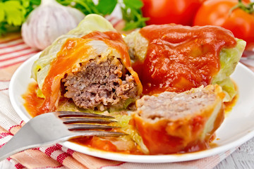 Cabbage stuffed with tomato sauce on light board