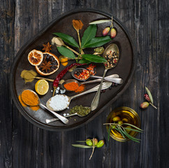 Various spices, olives and olive oil, top view
