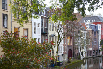 Fototapeta na wymiar View at houses near canal in Utrecht, The Netherlands