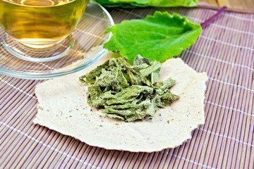 Sage dried on paper with cup on board