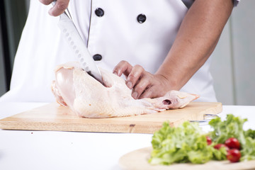 Close up Chef prepared cutting chicken breast
