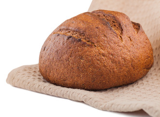 black round bread wrapped in a towel