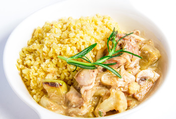 Meat stewed of rabbit closeup on white plate