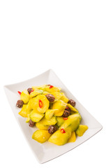 Pickled young mango with dried tamarind and chili slices