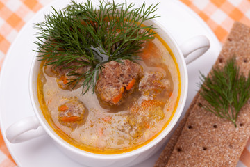 Soup with meatballs and dill
