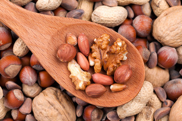 Nuts in a wooden spoon