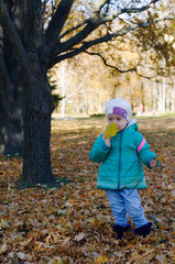 Little girl with oak leaves