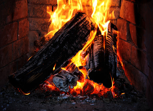 Burning fire wood in a fireplace