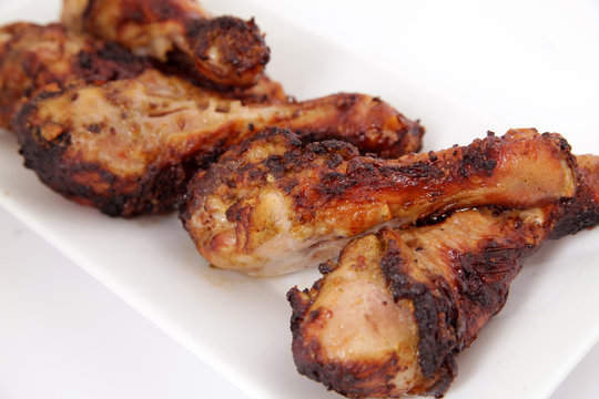 Close up of grilled chicken legs (drumsticks)