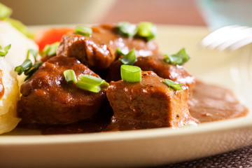 Goulash with boiled potatoes