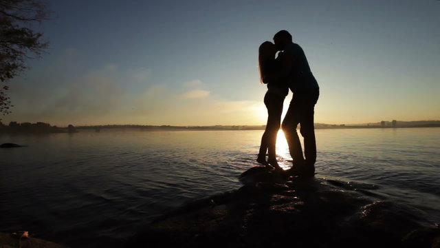 Silhouette of couples at sunset