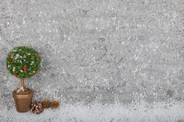 Christmas tree on grey limestone background