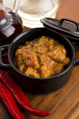 homemade hot goulash on wooden table