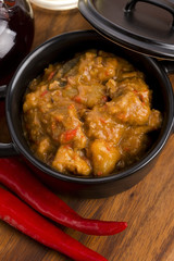 homemade hot goulash on wooden table