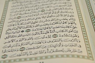 Fototapeta premium Open Koran with arabic writing visible