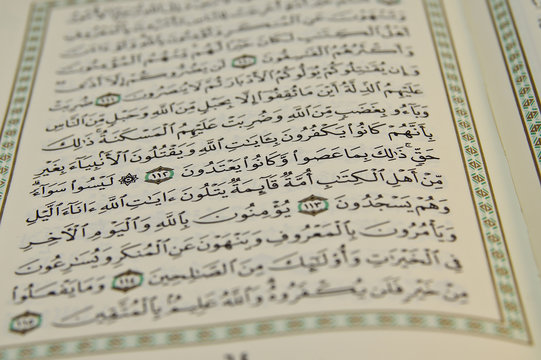 Open Koran with arabic writing visible