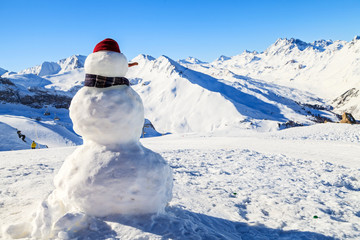 Fototapeta na wymiar Snowman in mountains