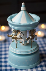 Toy carousel with young horses