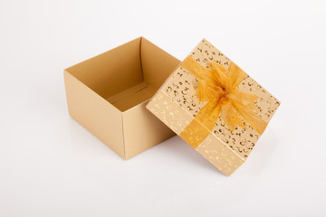 Golden christmas gift box with lid off
