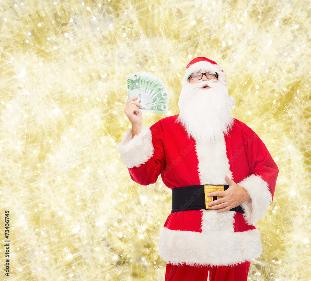 Canvas Prints man in costume of santa claus with euro money