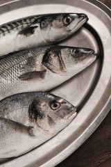 raw fish on metal platter