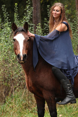 Fototapeta premium Pretty girl riding a horse without any equipment