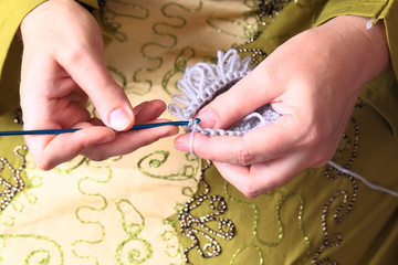 Close-up of hands knitting